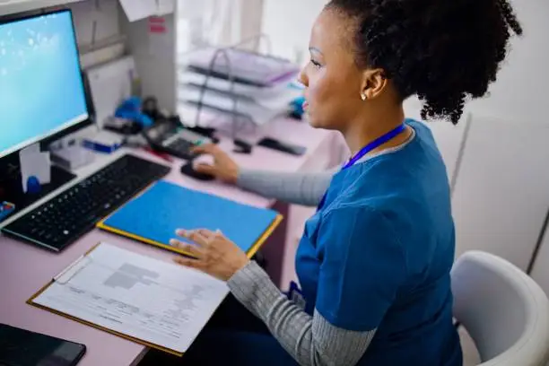 A clinician's workstation locked by a ransomware note in a small medical practice.